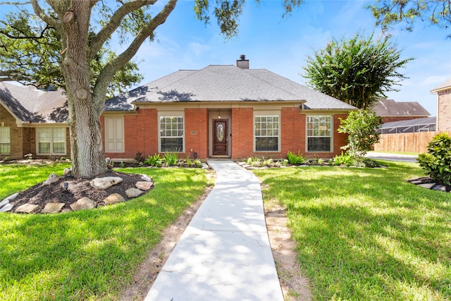 4311 Pebble Beach Dr, League City, TX 77573 - view of front facade with brick siding and a chimney