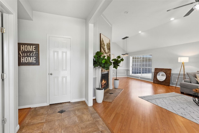 4311 Pebble Beach Dr, League City, TX 77573 - foyer entrance with a ceiling fan and a fireplace with flush hearth