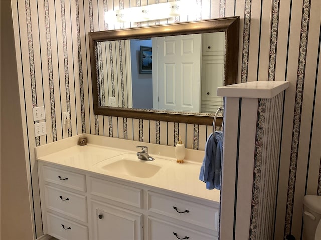 30 Piper Ln, Normangee, TX 77871 - bathroom featuring wallpapered walls and vanity