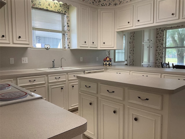 30 Piper Ln, Normangee, TX 77871 - kitchen with light countertops, plenty of natural light, and white cabinets