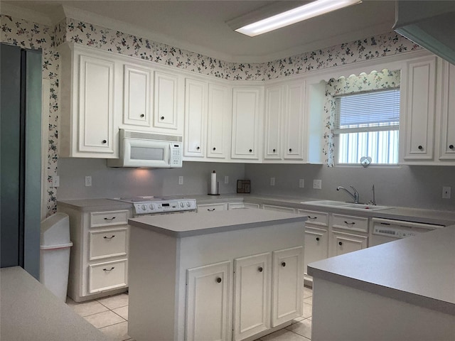30 Piper Ln, Normangee, TX 77871 - kitchen with white appliances, light tile patterned floors, and white cabinets