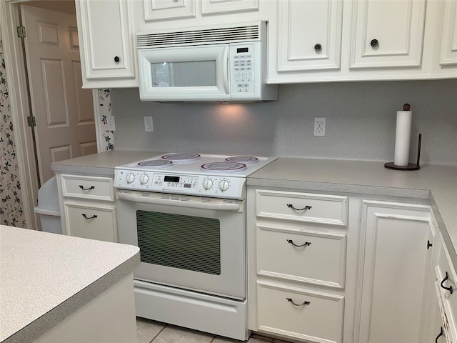 30 Piper Ln, Normangee, TX 77871 - kitchen featuring white appliances, white cabinetry, and light countertops