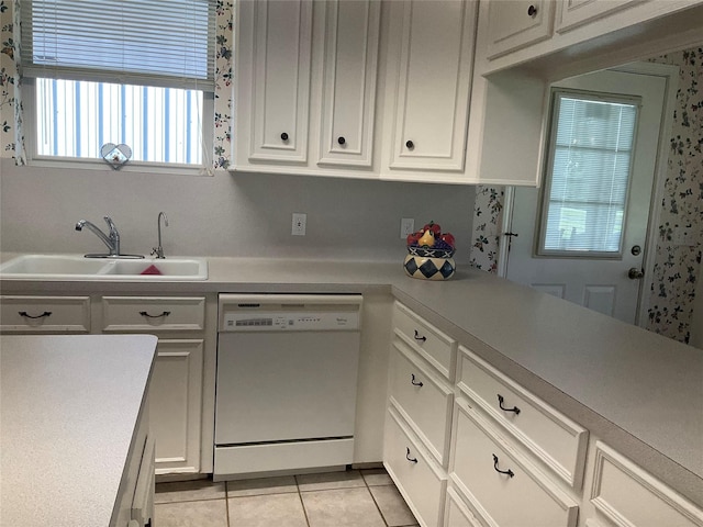30 Piper Ln, Normangee, TX 77871 - kitchen with dishwasher, light tile patterned floors, white cabinetry, and light countertops
