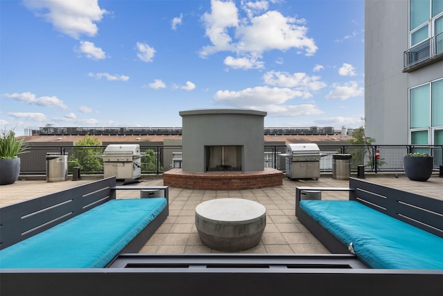 2000 Bagby St Unit 7414, Houston, TX 77002 - view of patio featuring area for grilling and an outdoor living space with a fireplace