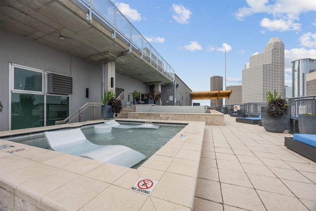 2000 Bagby St Unit 7414, Houston, TX 77002 - community pool featuring a patio