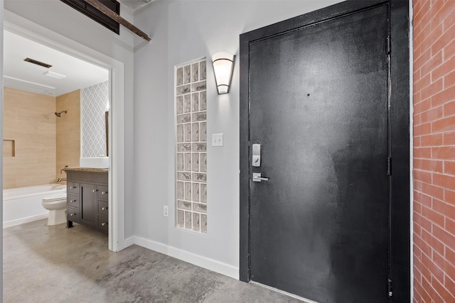 2000 Bagby St Unit 7414, Houston, TX 77002 - foyer with finished concrete flooring and baseboards