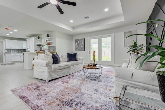 5226 Sanford Rd, Houston, TX 77035 - living area with a ceiling fan, recessed lighting, a raised ceiling, and light tile patterned floors