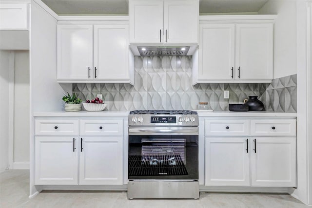 5226 Sanford Rd, Houston, TX 77035 - kitchen featuring gas stove, light countertops, white cabinets, custom exhaust hood, and backsplash