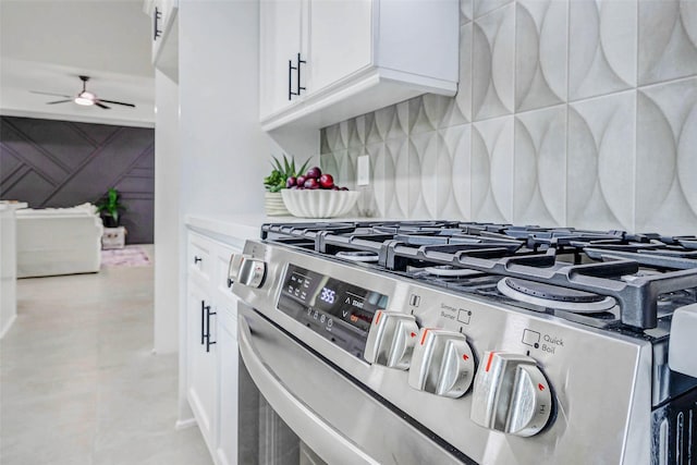 5226 Sanford Rd, Houston, TX 77035 - kitchen view of gas stove, a ceiling fan, white cabinetry, and backsplash