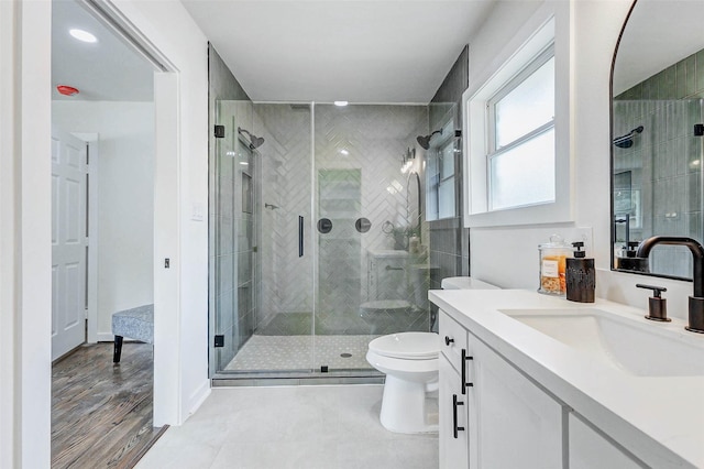 5226 Sanford Rd, Houston, TX 77035 - bathroom featuring vanity, a stall shower, and wood finished floors