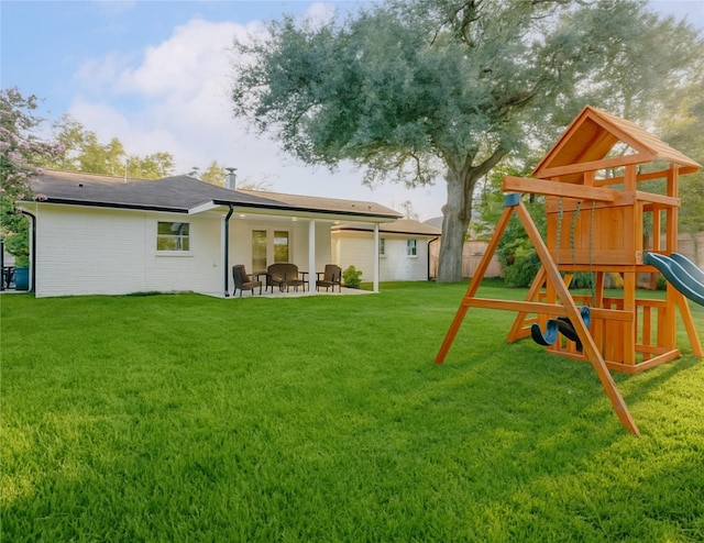 5226 Sanford Rd, Houston, TX 77035 - back of property featuring a playground and a patio area