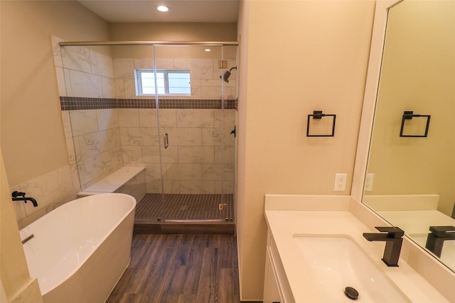 5213 Pinemont Creek Ln, Houston, TX 77018 - bathroom featuring a soaking tub, vanity, a stall shower, wood finished floors, and recessed lighting