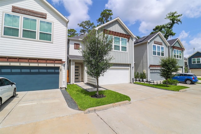 5213 Pinemont Creek Ln, Houston, TX 77018 - view of front of home featuring an attached garage, concrete driveway, and board and batten siding