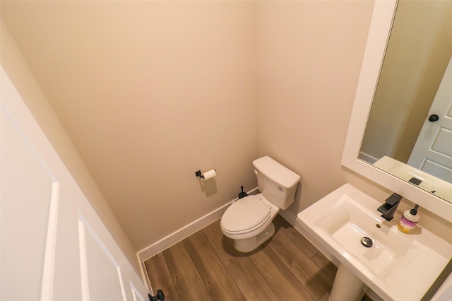 5213 Pinemont Creek Ln, Houston, TX 77018 - half bathroom with wood finished floors and toilet