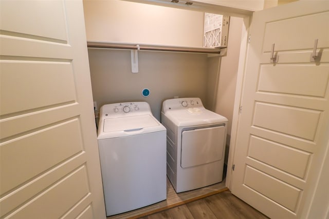 5213 Pinemont Creek Ln, Houston, TX 77018 - washroom featuring washer and clothes dryer and wood finished floors