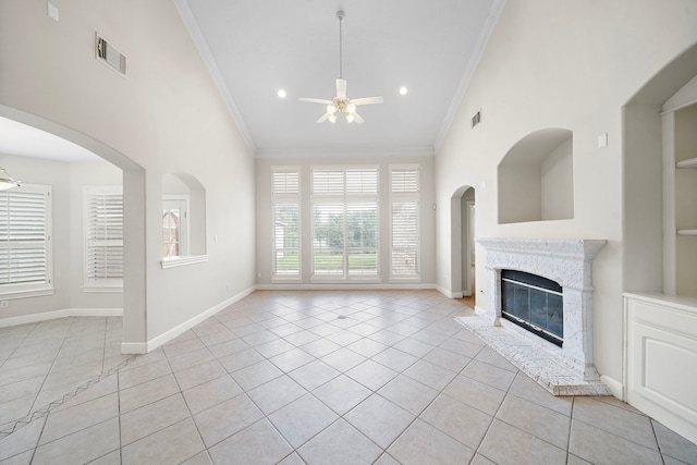 16426 Torry View Ter, Houston, TX 77095 - unfurnished living room featuring a ceiling fan, crown molding, light tile patterned floors, a premium fireplace, and recessed lighting