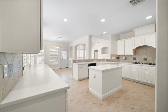 16426 Torry View Ter, Houston, TX 77095 - kitchen featuring stovetop, backsplash, light tile patterned floors, a peninsula, and recessed lighting