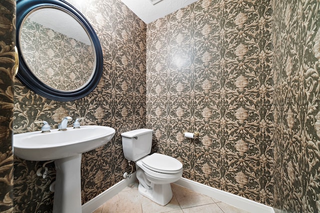 16426 Torry View Ter, Houston, TX 77095 - bathroom featuring wallpapered walls and tile patterned flooring