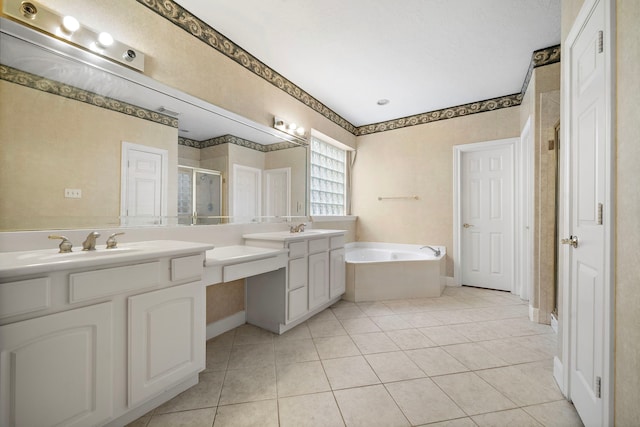 16426 Torry View Ter, Houston, TX 77095 - full bathroom featuring a stall shower, double vanity, a bath, and tile patterned flooring