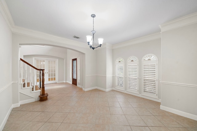 16426 Torry View Ter, Houston, TX 77095 - spare room featuring arched walkways, a chandelier, ornamental molding, light tile patterned floors, and stairway