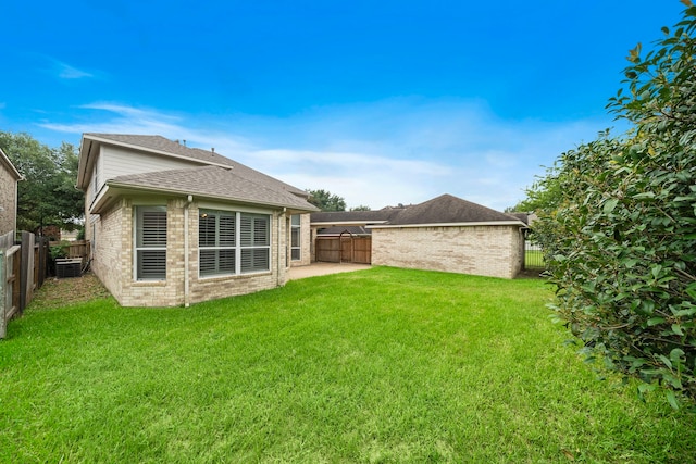 16426 Torry View Ter, Houston, TX 77095 - back of house with brick siding, a fenced backyard, a patio, and a shingled roof