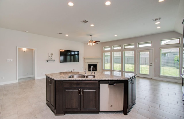 3605 Dolan Trail Ct, Pearland, TX 77584 - kitchen featuring dishwasher, ceiling fan, open floor plan, light stone counters, and an island with sink