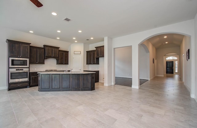 3605 Dolan Trail Ct, Pearland, TX 77584 - kitchen with appliances with stainless steel finishes, light countertops, backsplash, dark brown cabinets, and recessed lighting