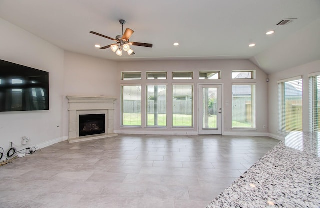3605 Dolan Trail Ct, Pearland, TX 77584 - unfurnished living room featuring a fireplace with raised hearth, ceiling fan, recessed lighting, and vaulted ceiling