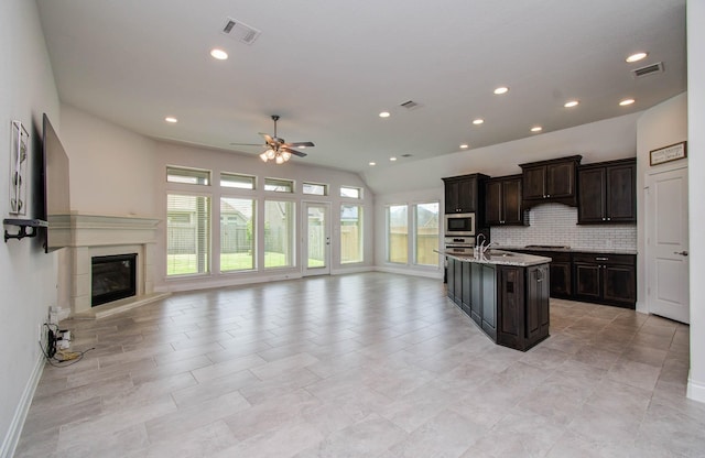 3605 Dolan Trail Ct, Pearland, TX 77584 - kitchen with stainless steel appliances, open floor plan, healthy amount of natural light, a ceiling fan, and recessed lighting