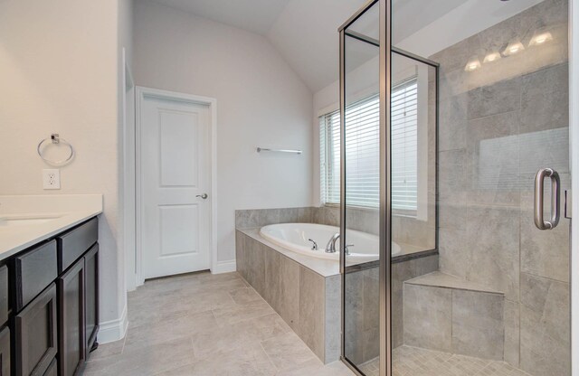 3605 Dolan Trail Ct, Pearland, TX 77584 - bathroom with a bath, a stall shower, vaulted ceiling, and vanity