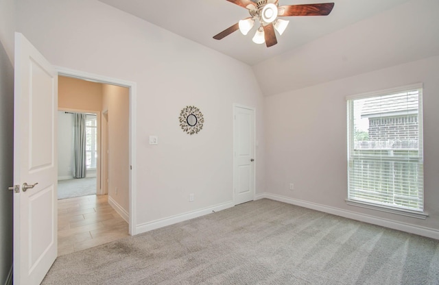 3605 Dolan Trail Ct, Pearland, TX 77584 - empty room with light carpet, plenty of natural light, ceiling fan, and lofted ceiling