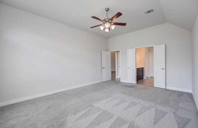 3605 Dolan Trail Ct, Pearland, TX 77584 - unfurnished bedroom featuring light colored carpet, lofted ceiling, connected bathroom, and a ceiling fan