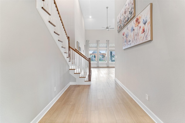 14315 Summer Prairie Trl, Cypress, TX 77433 - hall featuring stairs, wood finished floors, and a high ceiling