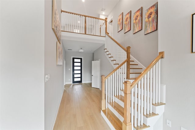 14315 Summer Prairie Trl, Cypress, TX 77433 - foyer entrance with a towering ceiling, wood finished floors, and stairs