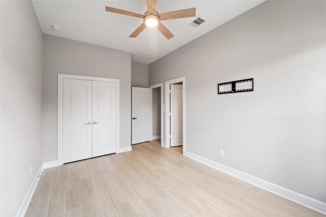 14315 Summer Prairie Trl, Cypress, TX 77433 - unfurnished bedroom featuring light wood-style flooring, a closet, and a ceiling fan