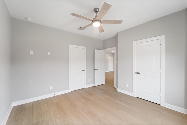 14315 Summer Prairie Trl, Cypress, TX 77433 - unfurnished bedroom featuring light wood-type flooring and a ceiling fan