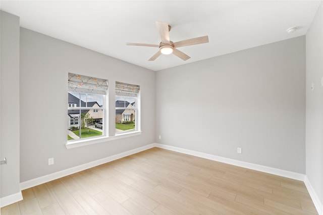 14315 Summer Prairie Trl, Cypress, TX 77433 - empty room featuring ceiling fan, a smoke detector, and light wood-type flooring
