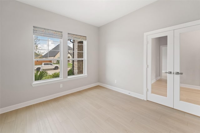 14315 Summer Prairie Trl, Cypress, TX 77433 - unfurnished room featuring french doors and light wood-style flooring