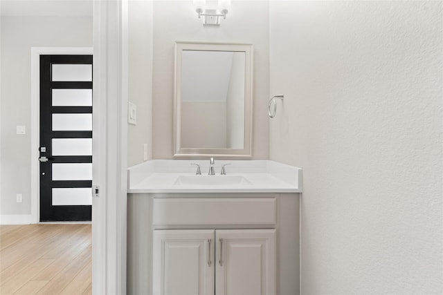 14315 Summer Prairie Trl, Cypress, TX 77433 - bathroom featuring vanity and wood finished floors