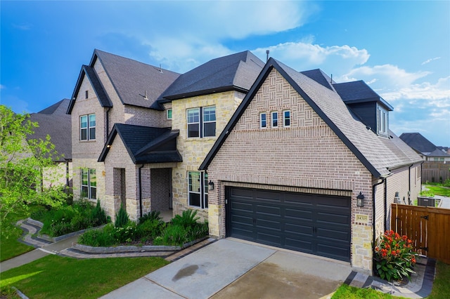 14315 Summer Prairie Trl, Cypress, TX 77433 - french country inspired facade with stone siding, driveway, and brick siding