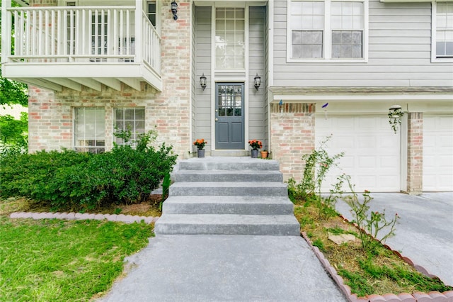 15403 Meadow Village Dr, Houston, TX 77095 - view of exterior entry with a garage, driveway, brick siding, and a balcony
