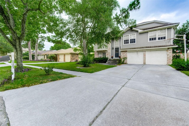 15403 Meadow Village Dr, Houston, TX 77095 - view of front of property with a front lawn, concrete driveway, brick siding, and an attached garage