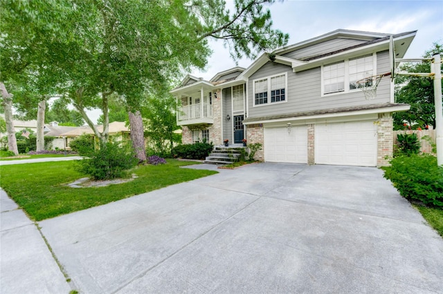 15403 Meadow Village Dr, Houston, TX 77095 - bi-level home featuring concrete driveway, a garage, a front lawn, and brick siding