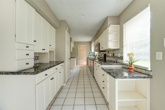 15403 Meadow Village Dr, Houston, TX 77095 - kitchen featuring open shelves, stainless steel appliances, white cabinetry, and light tile patterned floors