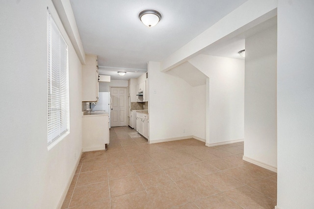 1605 30th St N, Texas City, TX 77590 - hallway with light tile patterned floors and baseboards
