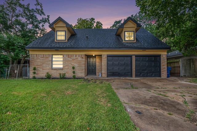 1605 30th St N, Texas City, TX 77590 - view of front of home featuring brick siding, a garage, a shingled roof, and concrete driveway