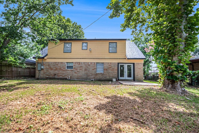 1605 30th St N, Texas City, TX 77590 - back of house with french doors, brick siding, and a patio area