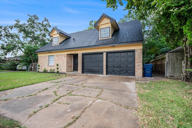 1605 30th St N, Texas City, TX 77590 - view of front of property with brick siding, a garage, concrete driveway, and roof with shingles