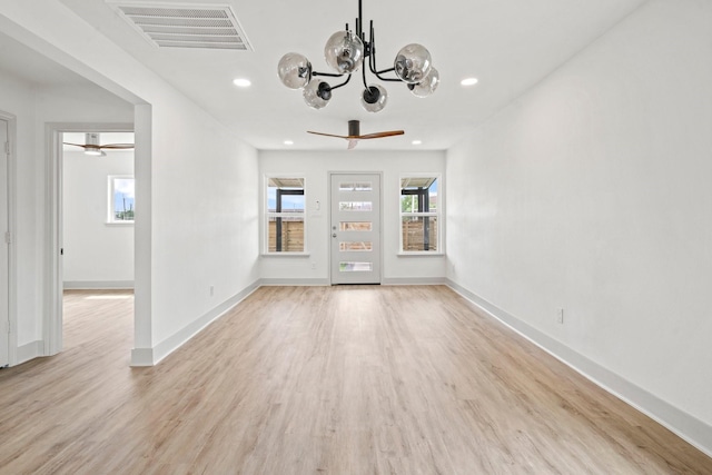 1009 Genova St, Houston, TX 77009 - empty room with a ceiling fan, a chandelier, light wood-type flooring, and recessed lighting
