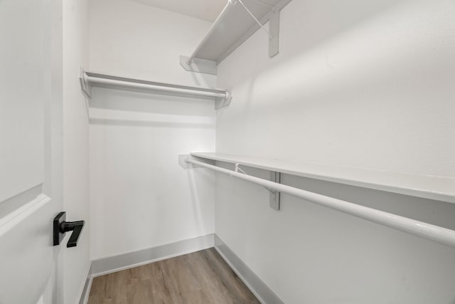 1009 Genova St, Houston, TX 77009 - walk in closet featuring wood finished floors